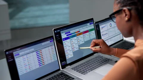 Human Resource Manager Scheduling Candidate Interviews Using Laptop Stock Footage 344719398