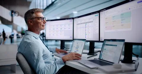Human Resources Manager Analyzing Employee Performance Data On Laptop Compute Фото