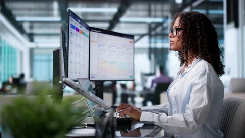 Human Resources Manager Carefully Reviews Candidate Resumes During Hiring Stock Footage 340405672