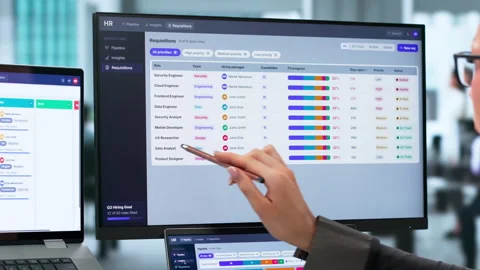 Human Resources Manager Carefully Reviews Candidate Resumes On Laptop Stock Footage 344714765