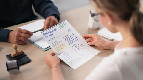 Human Resources Manager Discussing Annual Employee Performance Review Stock Footage 336792267