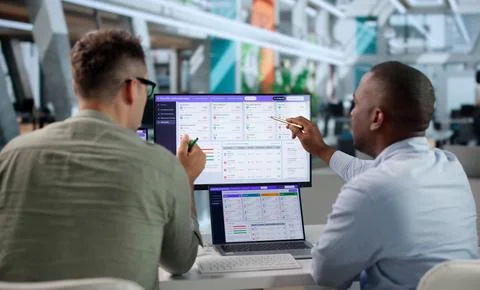 Human Resources Manager Explains Benefits Enrollment Using Laptop Software At Stock Photos