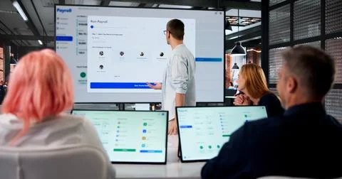 Human Resources Manager Explains Payroll Software Integration During Team Tra Stock Photos