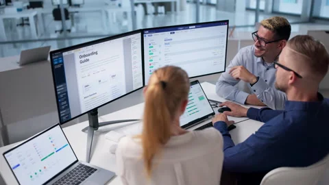 Human Resources Manager Leads Diverse Team Using HR Software For Recruitment Stock Footage 336790076