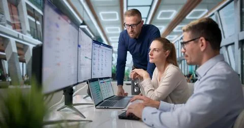 Human Resources Manager Leads Diverse Team Reviewing Payroll Software Feature Stock Photos