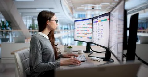 Human Resources Manager Using Software To Organize Employee Attendance Dates. Stock Photos