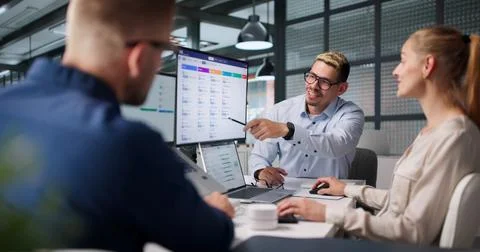 Human Resources Team Meets Around Laptop Discussing Recruitment Software Feat Stock Photos