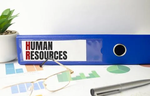 Human resources text written on folder with documents Stock Photos
