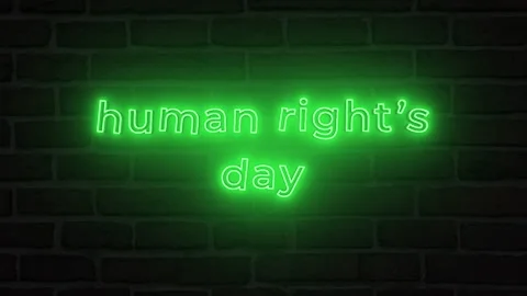 Human rights day with neon text effect in black background. Seamless looping 4k  Stock Footage 292914214