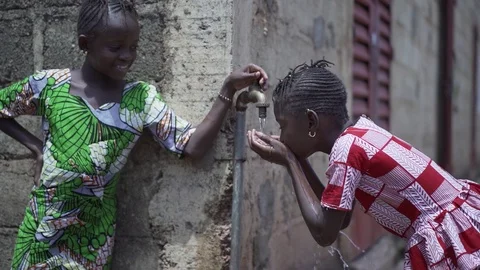 Human Rights Issues: Girls Drinking Water Stock Footage 122415487