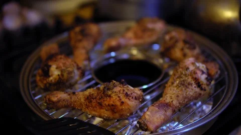 Human roasts chicken legs on a home gas grill. Stock Footage 121471428