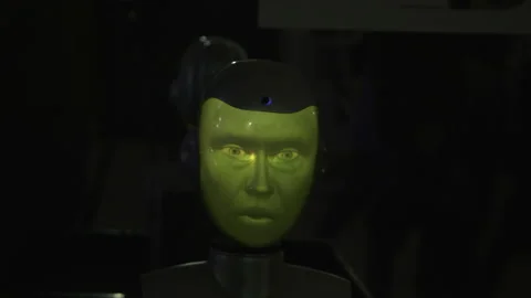 Human robot. HDR.A green face made like a living one that can turn. Stock Footage 170064994