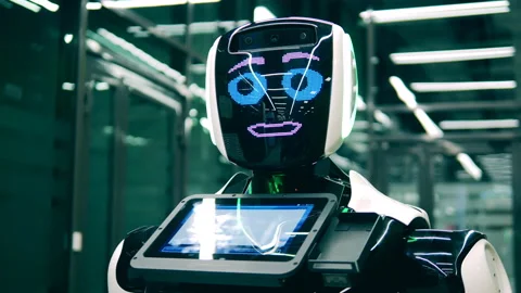 Human-like robotic machine is talking and winking. Futuristic cyborg, innovative Video stock 145834804