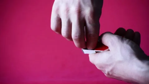 Human rude arms lighting match, studio video Stock Footage 168538214