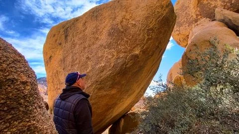 🚶‍♂️ Human Scale: Exploring the Alien Red Rocks of Joshua Tree Stock Photos