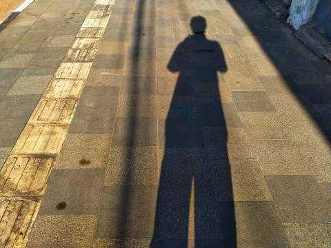 Human shadow on the street Stock Photos