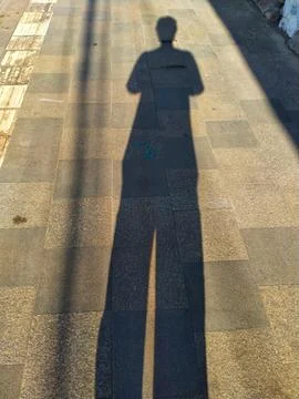 Human shadow on the street Stock Photos