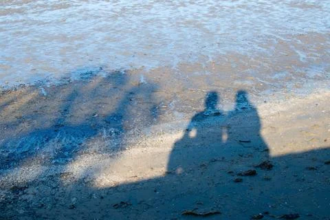 Human shadows on a beach in Australia Stock Photos