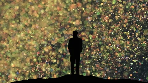 The human silhouette standing on a magic flying particles background Stock Footage 165354045