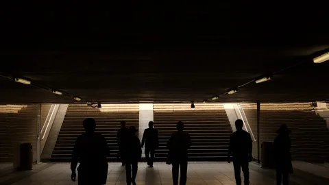 Human silhouettes in underground hallway. Stock Footage 111756589