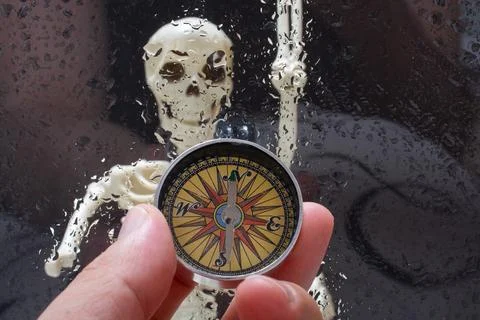 Human skeleton model behind compass. Medical anatomy science Stock Photos