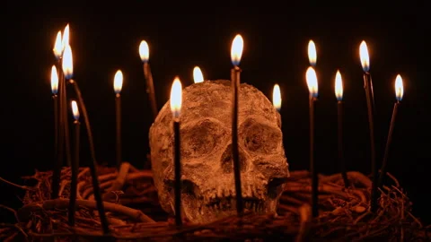Human skull and black magic candles spirituality setup. Mystic and occult e.. Stock Footage 345451182