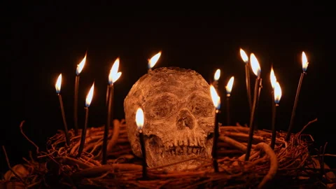 Human skull and black magic candles spirituality setup. Mystic and occult e.. Stock Footage 345456448