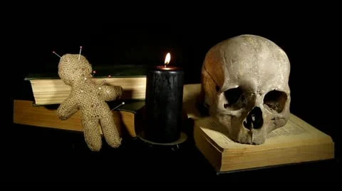 Human skull and voodoo doll Stock Footage 12026023