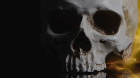 Human skull burning close up religious imagery Stock Footage 143351884
