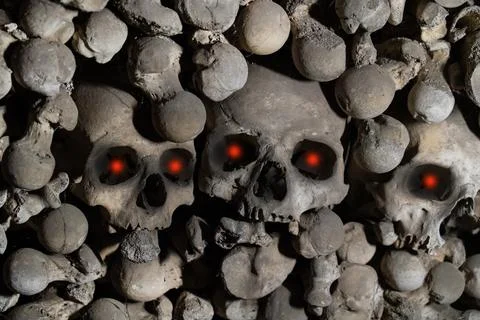 Human skull with glowing demonic, red eyes close up, human bones pattern Stock Photos