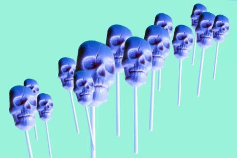 Human skull lollipops pattern in neon colors ,trendy art halloween background Stock Photos