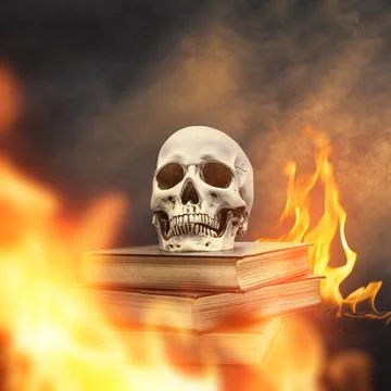 Human skull resting on a stack of old books surrounded by burning flames an.. Stock Photos