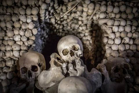 Human skulls and bones. Gothic vault. mass grave. Texture. Kostnice in Kutna Stock Photos