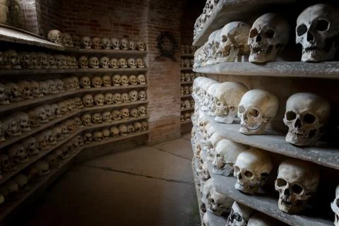Human skulls inside a catacomb inside a catacomb Stock Photos