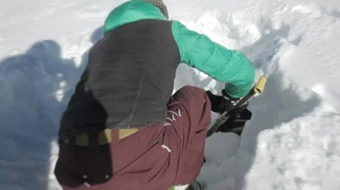 Human in snow hole Stock Footage 46154497