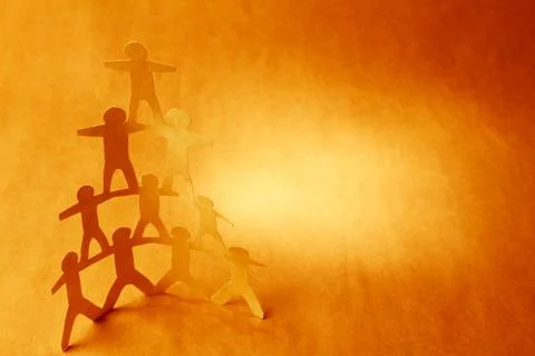 Human team pyramid supporting each other Stock Photos