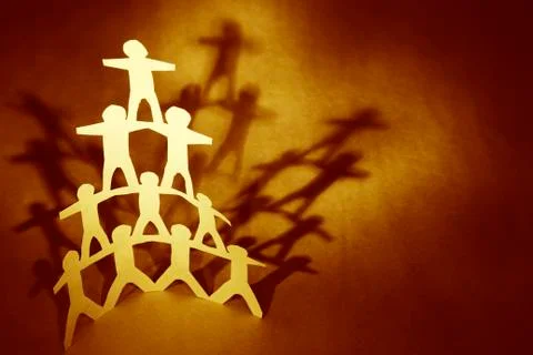 Human team pyramid supporting each other Stock Photos