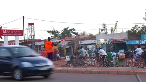 Human traffic light in Ouaga Stock Footage 80625744