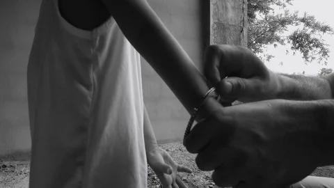 Human trafficking of children, Stop abusing violence, The boy tied with a rope,  Stock Footage 82626664