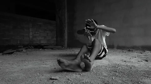Human trafficking. ,Stop abusing violence.,The boy tied with a rope. Stock-Footage 82627461