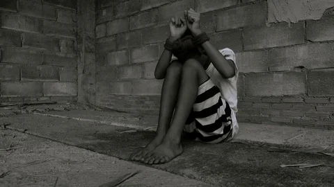Human trafficking. ,Stop abusing violence.,The boy tied with a rope. Stock-Footage 82629020