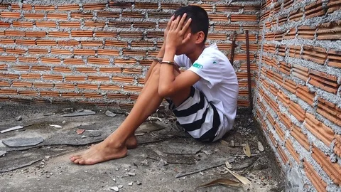 Human trafficking. ,Stop abusing violence.,The boy tied with a rope. Stock Footage 82632245