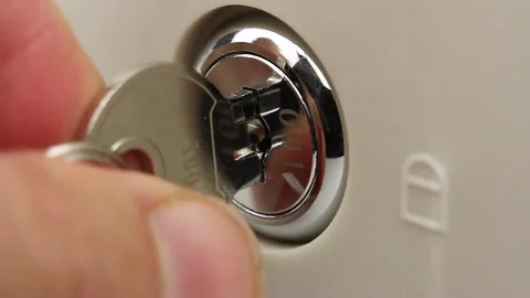 Human try to open lock of safe or cash drawer with key, gets stuck Видео 145535889