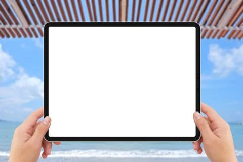 Human two hands holding white tablet computer white screen mockup near beach Stock Illustration