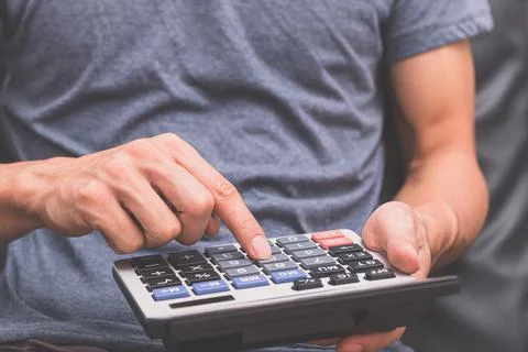 A human using a calculator Stock Photos
