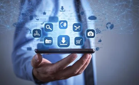 Human using smartphone. App icons with a download symbol. Development of ap.. Stock Photos