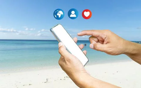 A human using a smartphone with Social media. The concept of living on vacati Stock Photos