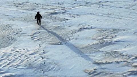 Human walk throw the snowfield. Video stock 122938082