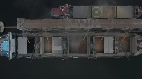 Humanitarian food program. Loading of Ukrainian grain to bulker ship. Aerial Stock Footage 244743465