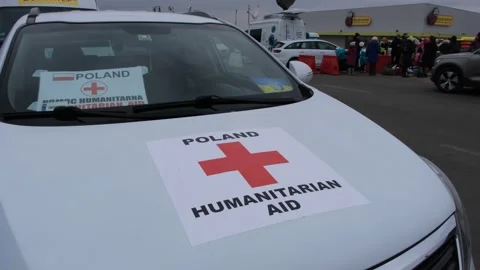 Humanitarian operators bus wait for cross the border Stock Footage 172070784